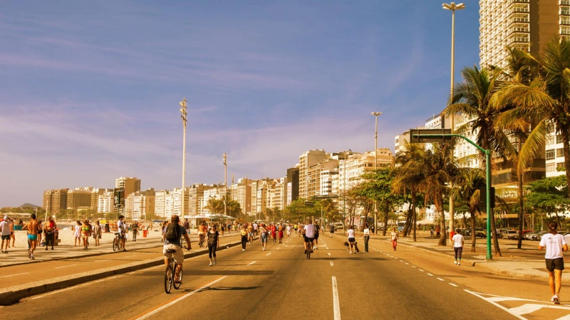 people walking and cycling on Copacabana promenade Rio