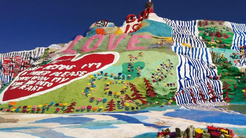Slab City California Salvation Mountain painted hill visitors