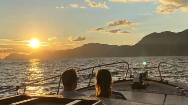 Amalfi Coast boat tour with scenic cliffs, turquoise sea, and coastal views of Italy from the water