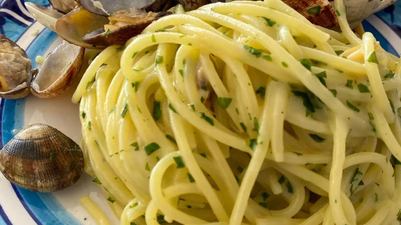Amalfi Coast seafood pasta with clams and fresh herbs