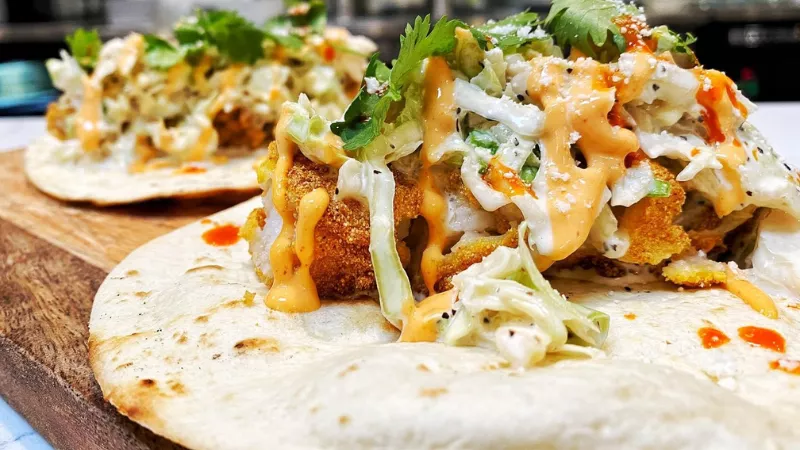 Silos in Celina Texas street tacos with crispy chicken, fresh slaw, and creamy sauce gourmet dining dish