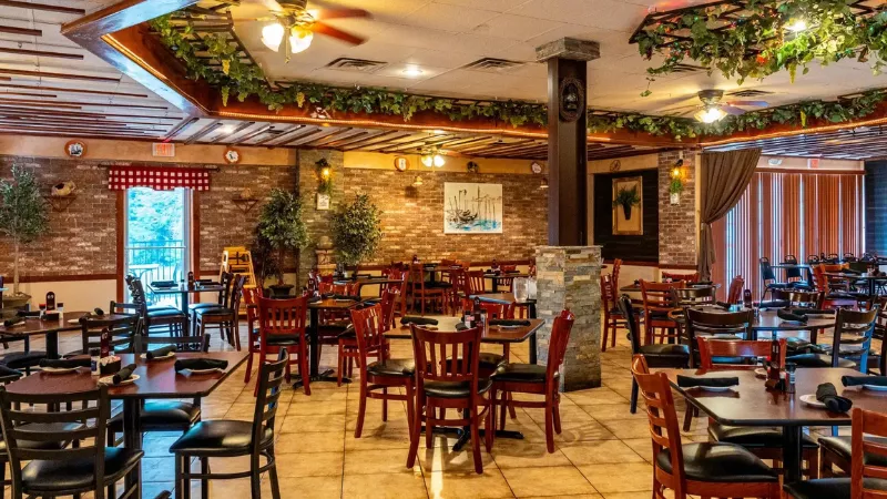 Bella’s Italian Grille Celina Texas cozy restaurant interior with warm lighting and dining tables