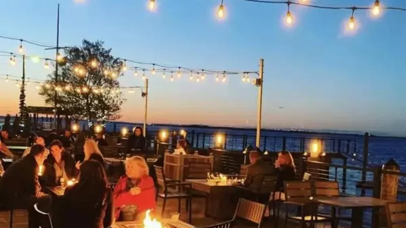 Pullman Bay Restaurant Celina Ohio waterfront outdoor dining with lake view and evening lights