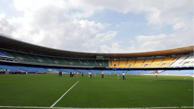 Maracana Stadium tour in Rio de Janeiro with visitors on the football field