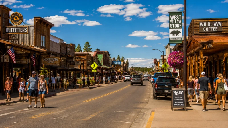 West Yellowstone Montana main street with restaurants and shops on a busy summer afternoon near Yellowstone National Park