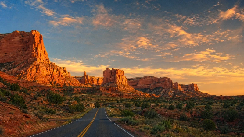 red sandstone cliffs and highway outside Kanab Utah at golden hour