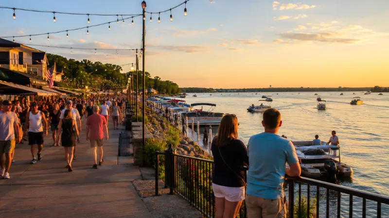 The Best Time to Visit Celina, Ohio 2 visitors walking along the Grand Lake St. Marys waterfront in Celina Ohio on a summer evening