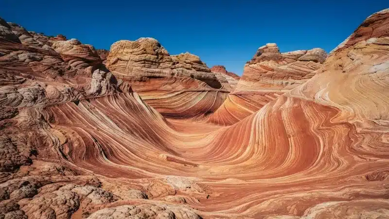 Swirling multicolored sandstone formations at White Pocket near Kanab Utah