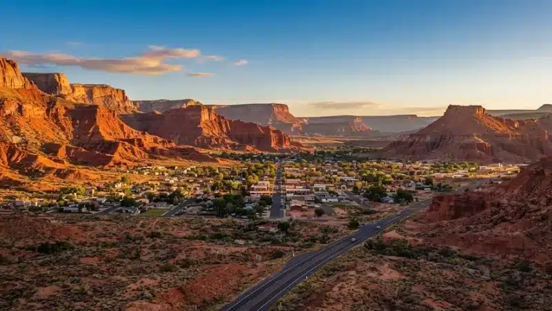 Kanab Utah red rock cliffs and desert town at golden hour