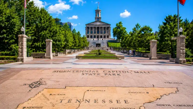 Granite Tennessee state map at Bicentennial Capitol Mall State Park with the State Capitol building in the background