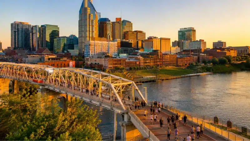  Nashville skyline and pedestrian bridge at golden hour in spring